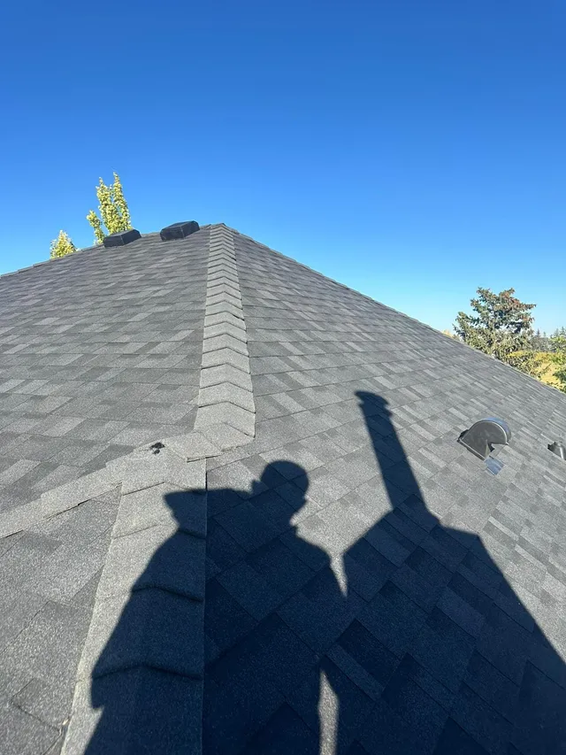 High-profile ridge cap shingles installed along the peak of a Calgary roof