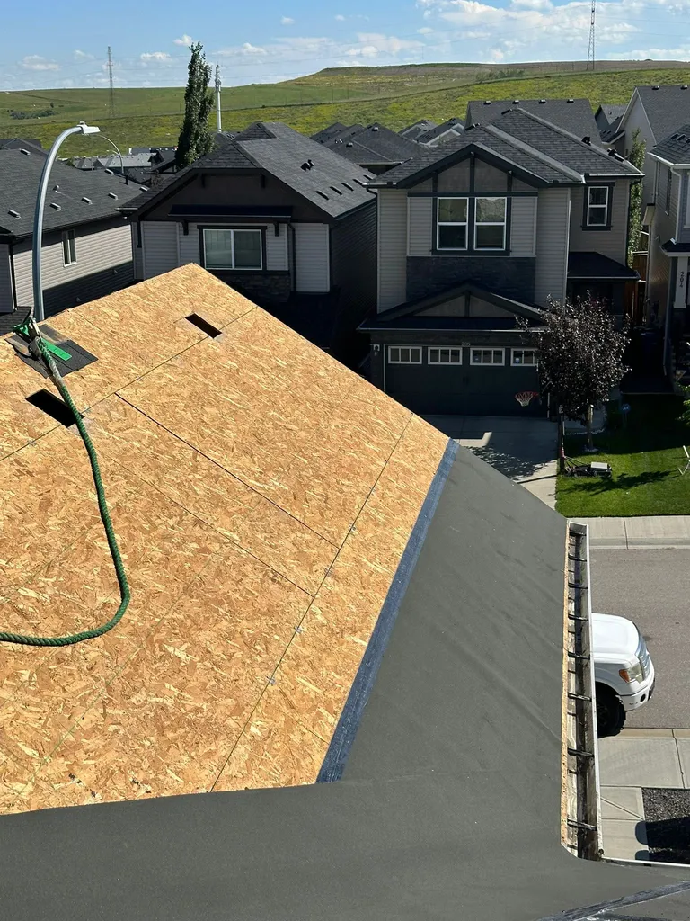 Ice and water membrane installed 36 inches from the eaves, compliant with Alberta roofing code