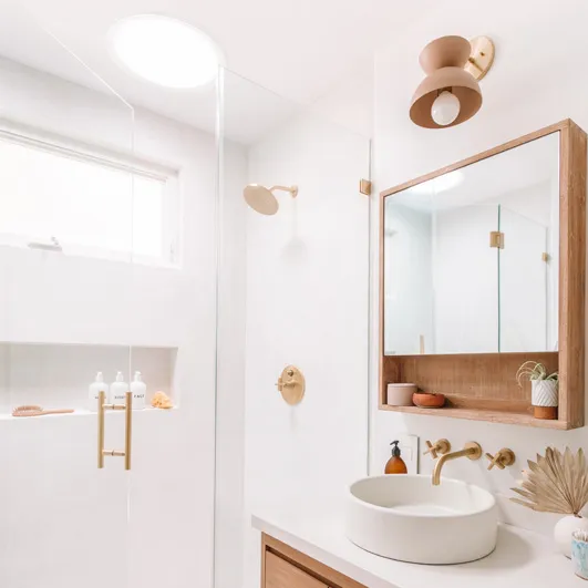 VELUX Sun Tunnel skylight bringing natural daylight into a windowless Calgary bathroom